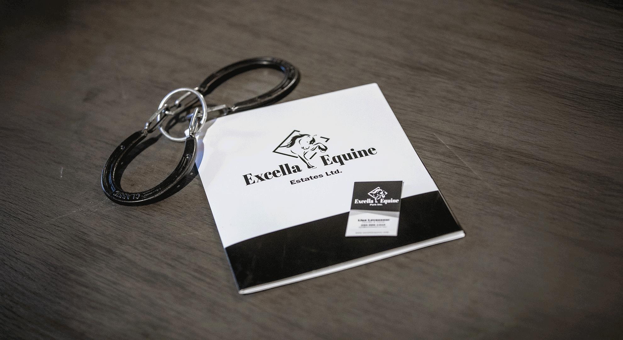 Trainer walking through the corridor of the heated barn at Excella Equine Park – behind-the-scenes view of our full-service equestrian facility in Stony Plain, Alberta.